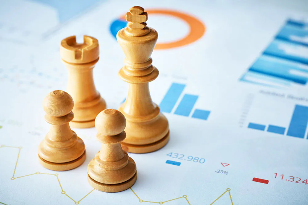 Chess pieces on some business documents