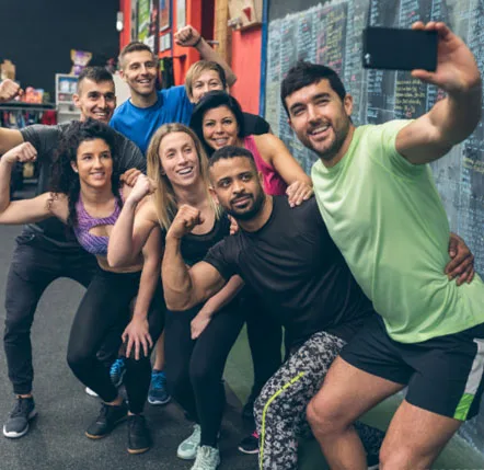 A scavenger hunt team quickly posing for a group selfie.